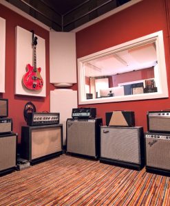 GIK Acoustics 242 Acoustic Panels behind guitars