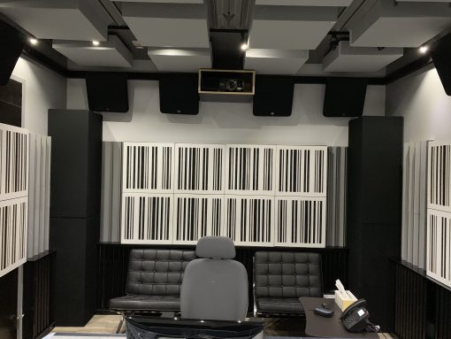 GIK Acoustics Alpha Series 1D in black with white plate in studio on back wall