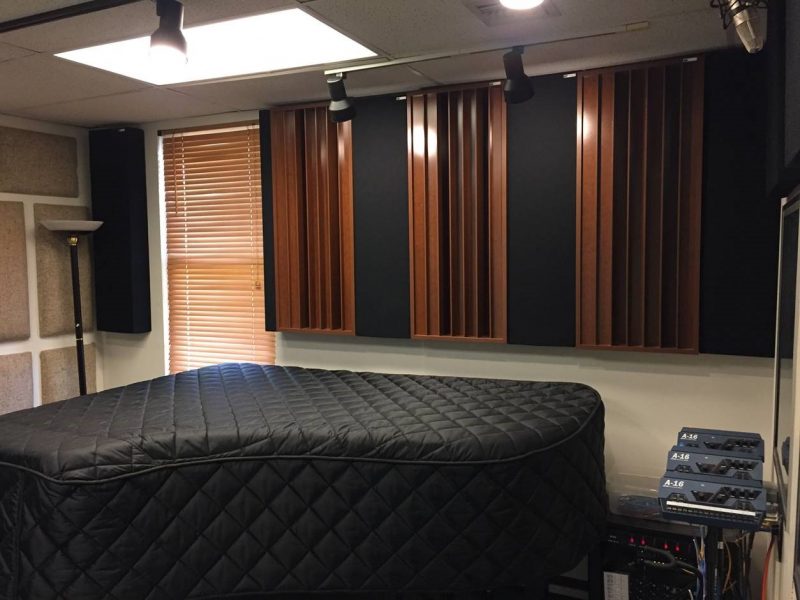 Diffusors and bass traps by GIK Acoustics back wall covered piano GIK Acoustics in Tiki Recording Studio