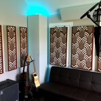 Home recording studio ideas with GIK Acoustics Impression series acoustic panels and white soffit bass traps and couch