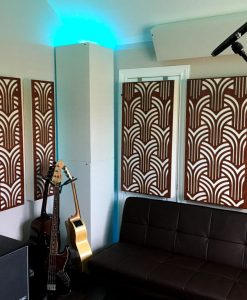 Home recording studio ideas with GIK Acoustics Impression series acoustic panels and white soffit bass traps and couch