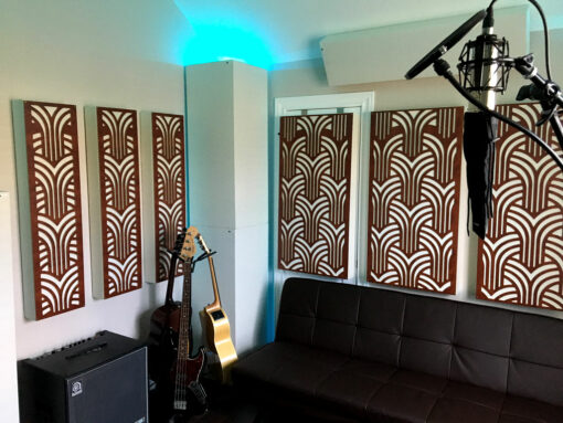 Home recording studio ideas with GIK Acoustics Impression series acoustic panels and white soffit bass traps and couch